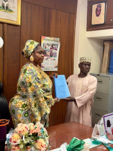 Mr. Wodi Handing over to Mrs. Opaluwa